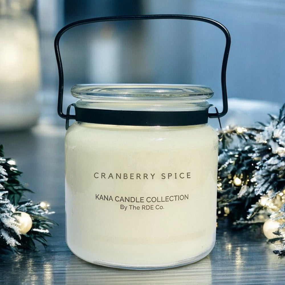 
                  
                    20oz KANA Candle with double wick in glass jar with black handle lovely cranberry spice scent and option to personalize label
                  
                