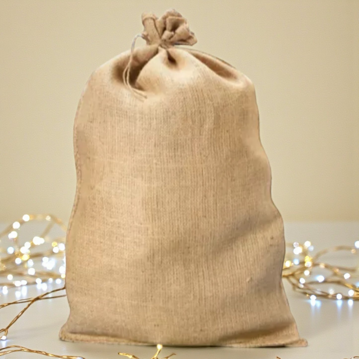 Burlap sac with some Christmas lights in background