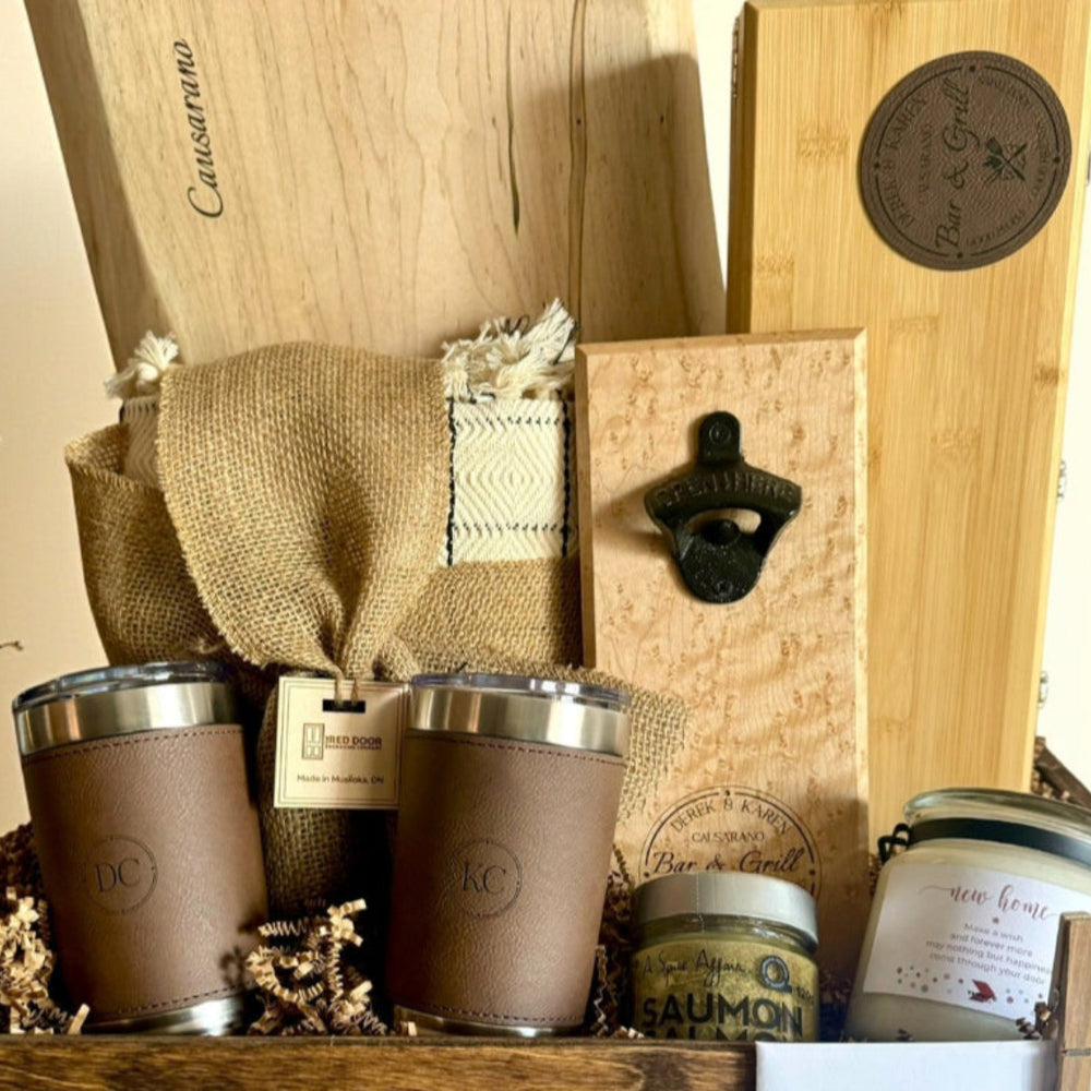 Gift basket with 'Causarano' branding featuring jars, a bottle opener, and decorative items.