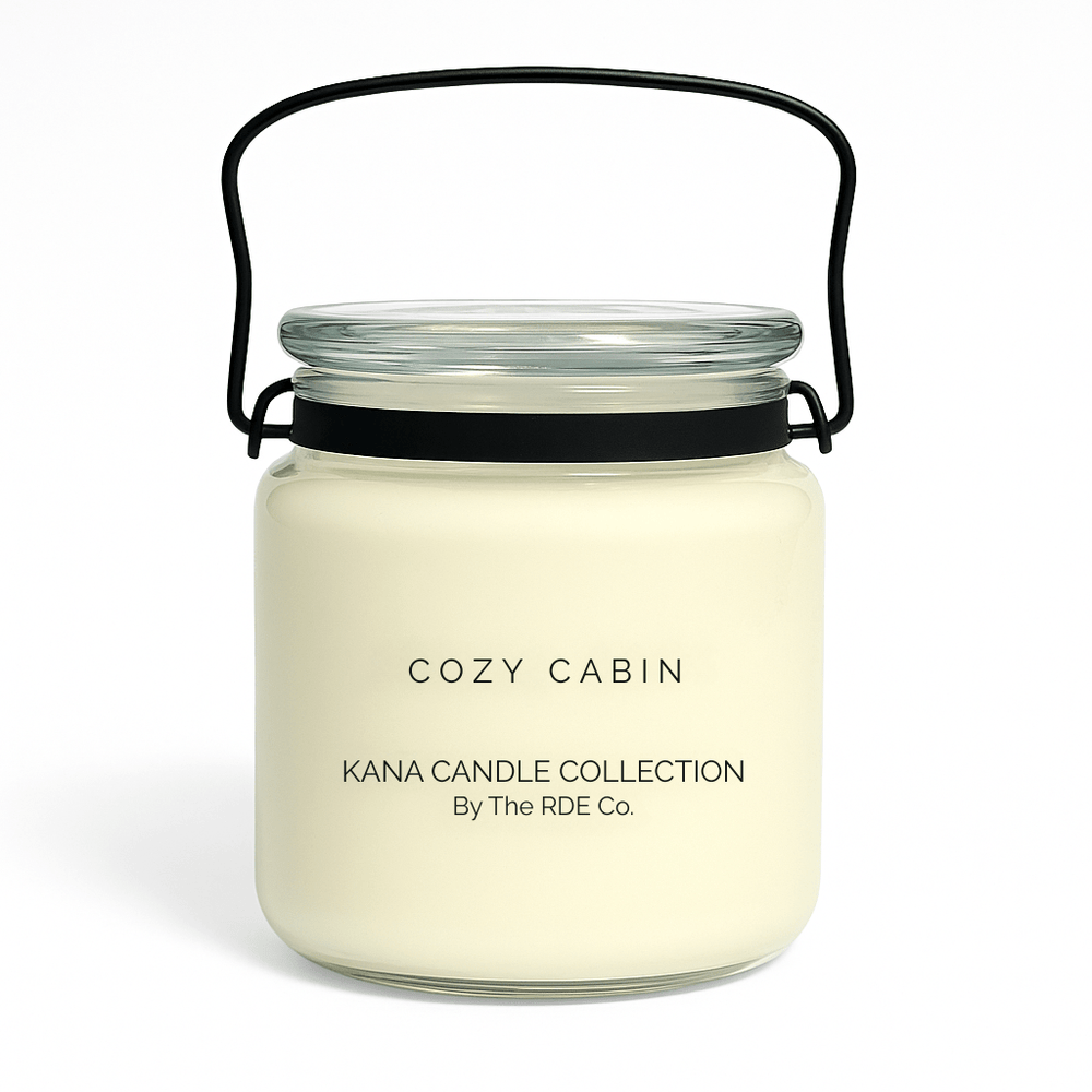 Kana Candle in Cozy Cabin, 20oz soy candle in glass jar with handle & white background