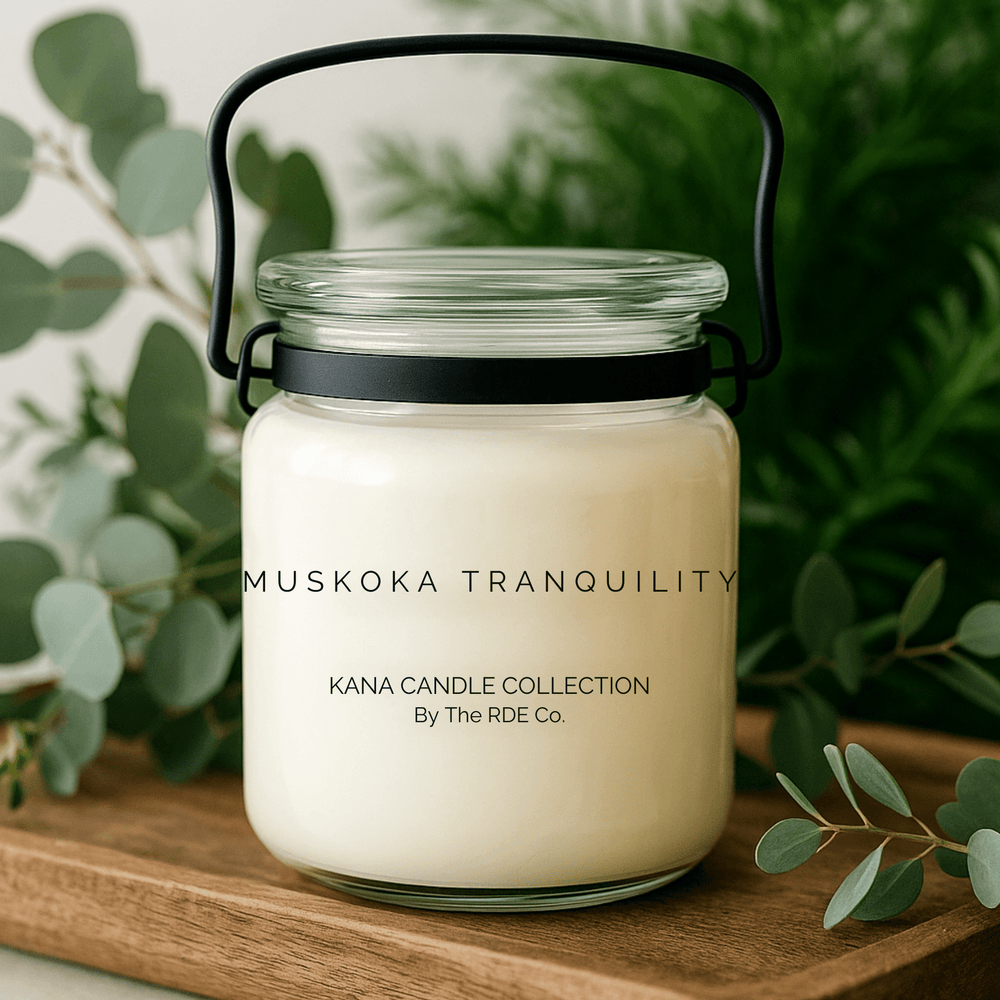 
                  
                    Kana Candle in Muskoka Tranquility, 20oz soy candle in glass jar with handle & Greenery background
                  
                