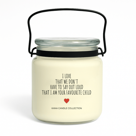 Mother’s Day soy candle with label that reads “I Love That We Don’t Have to Say Out Loud That I Am Your Favourite Child”