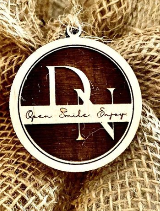 
                  
                    Circular cut gift tag engraved with Monogram in Baltic birch - The Red Door Engraving Company Inc.
                  
                