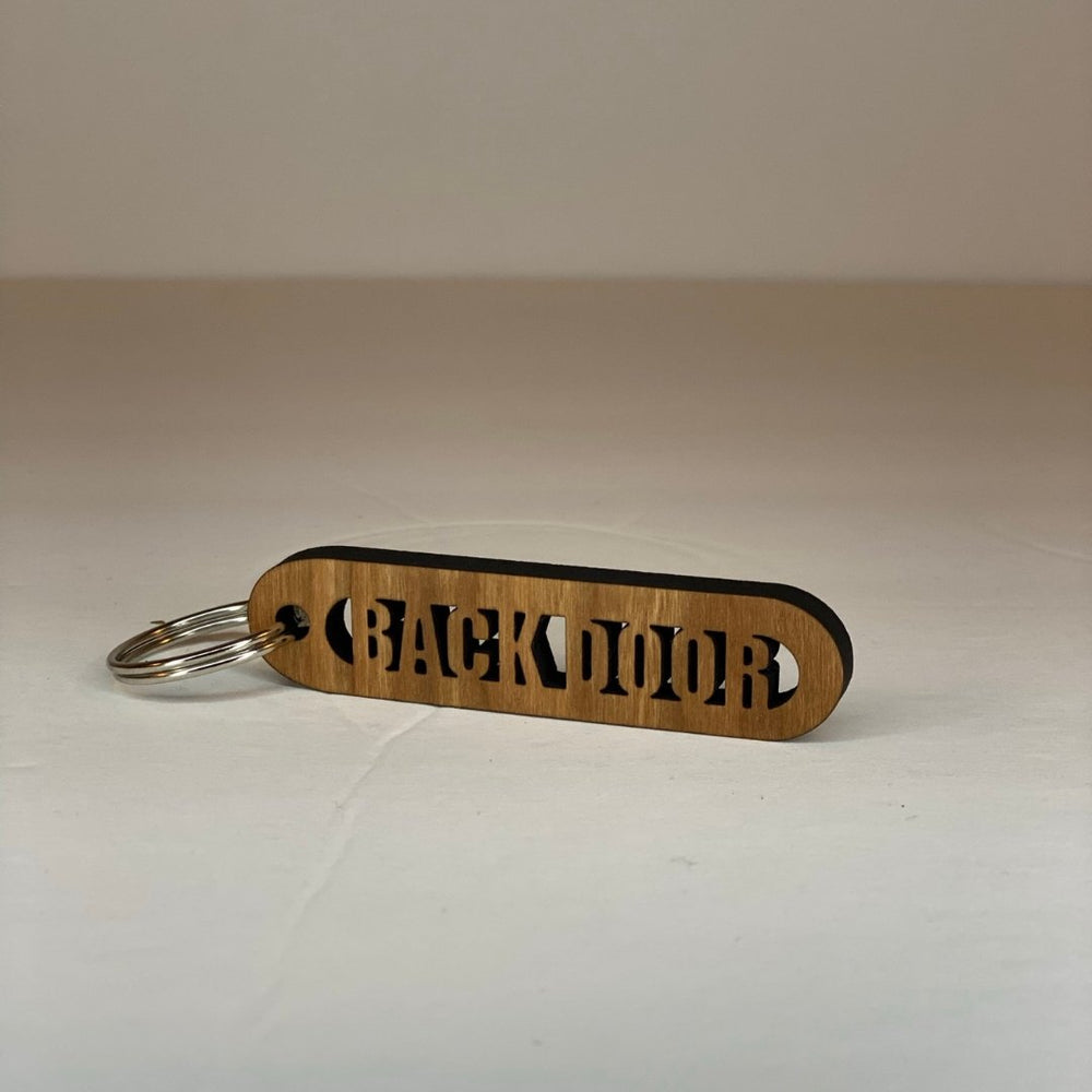 
                  
                    Cherry Wood Cut-Out Keychains Back Door - The Red Door Engraving Company Inc.
                  
                