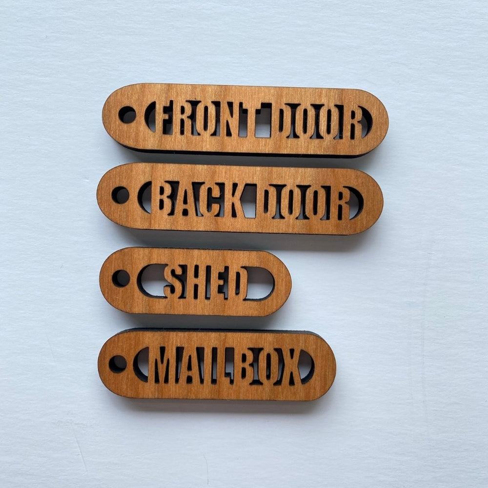 
                  
                    Various Cherry Wood Cut-Out Keychains - The Red Door Engraving Company Inc.
                  
                