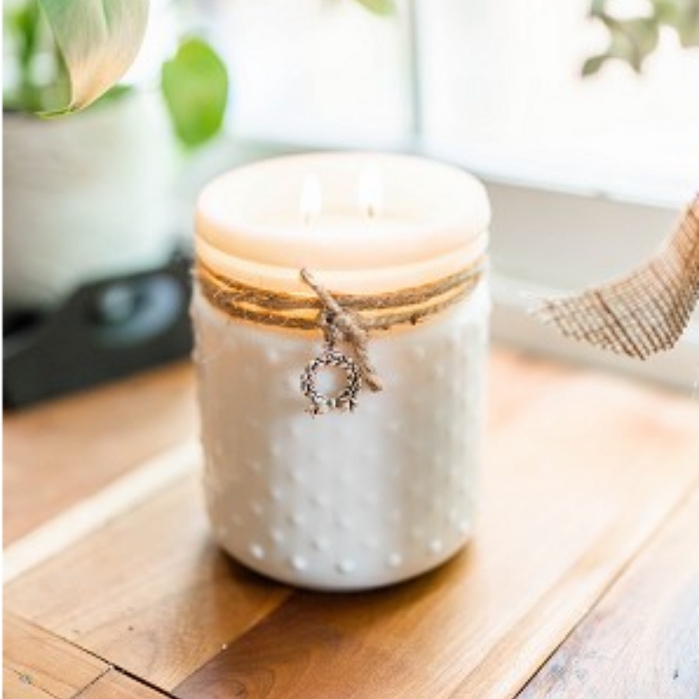 
                  
                    white glass jar hobnail candle with charm
                  
                