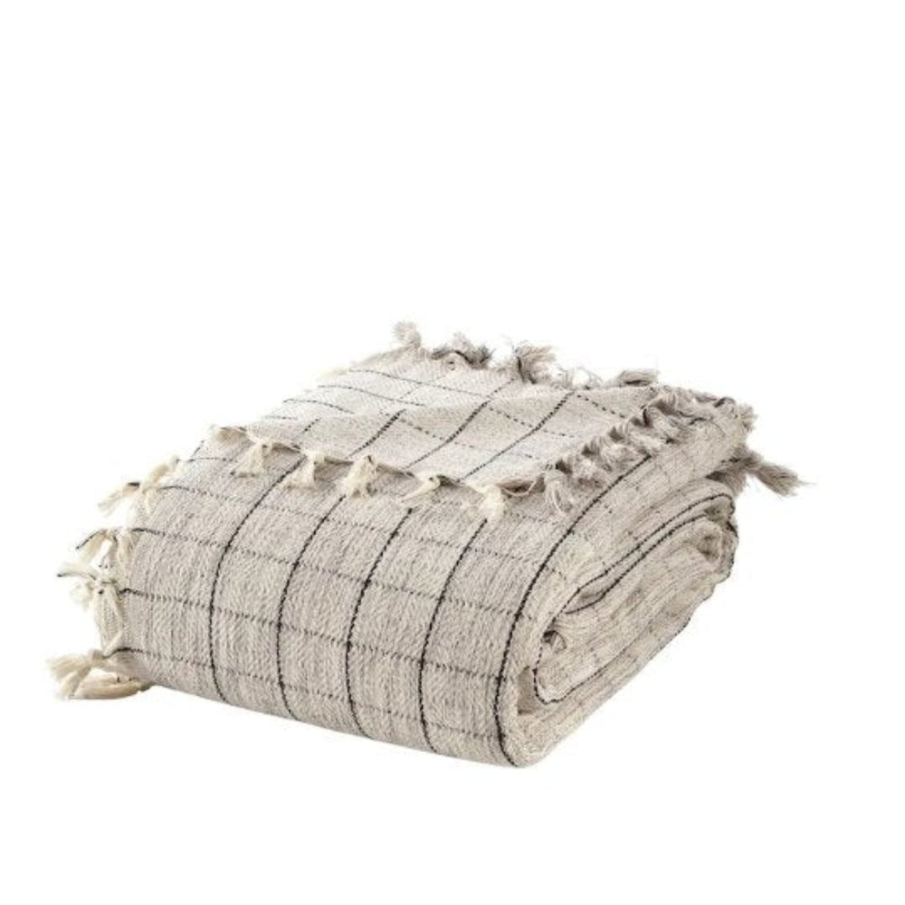 grey and ebony turkish throw blanket  folded neatly with tassels white