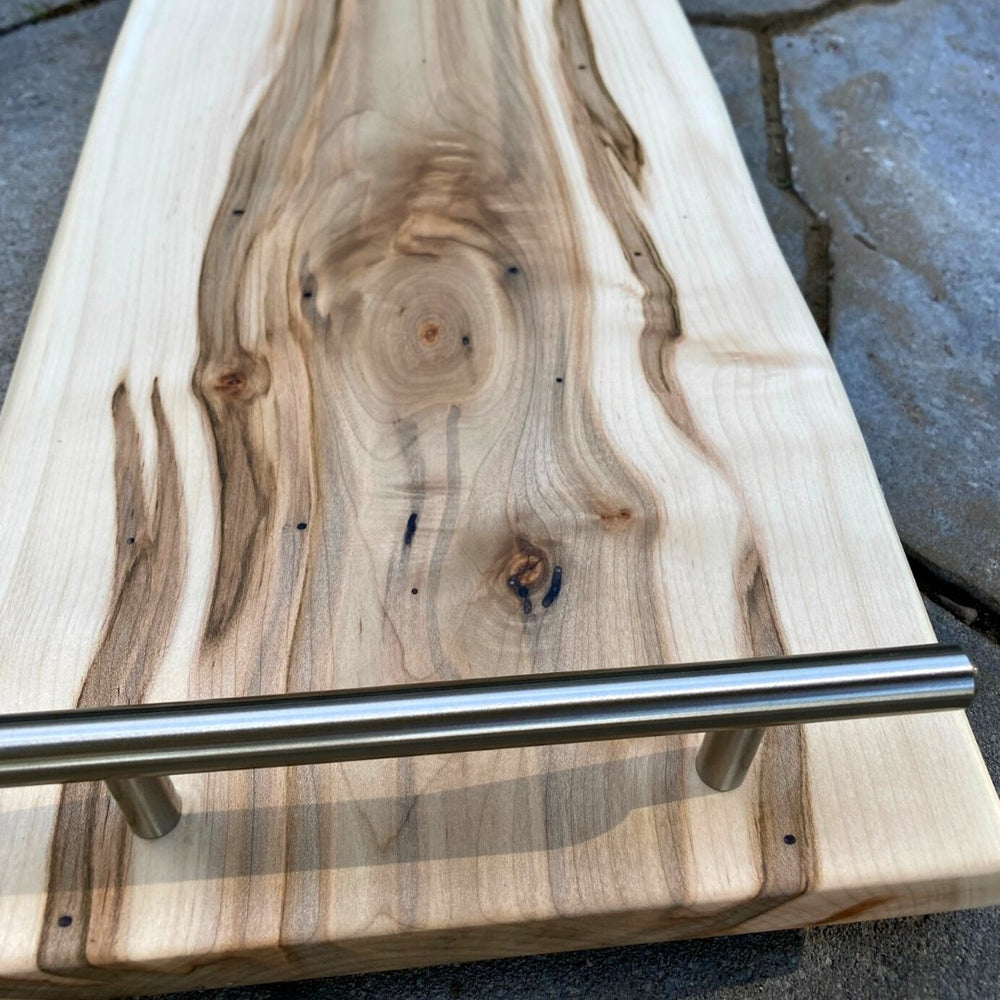 
                  
                    front of maple board showing stainless steel 7" handles
                  
                