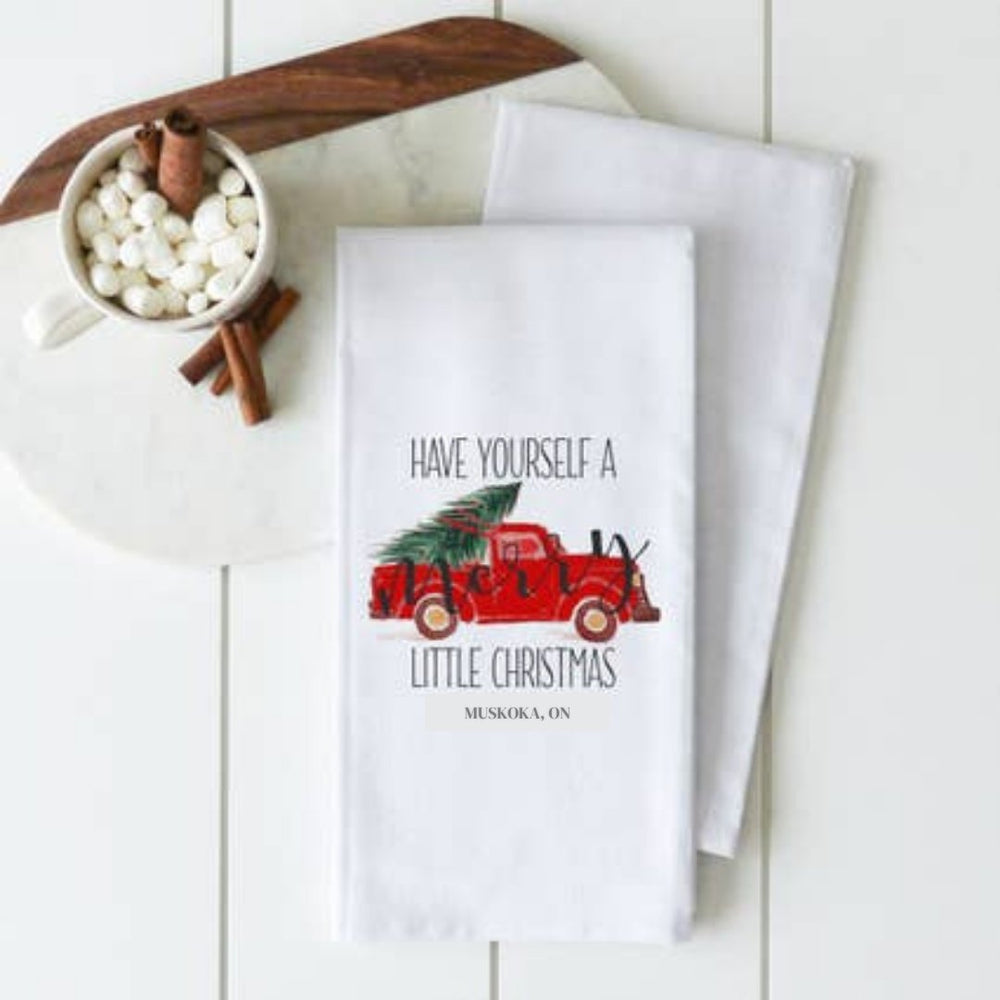 
                  
                    Merry Christmas Tea Towel with red truck and green christmas tree in back - White Cotton - The Red Door Engraving Company Inc
                  
                