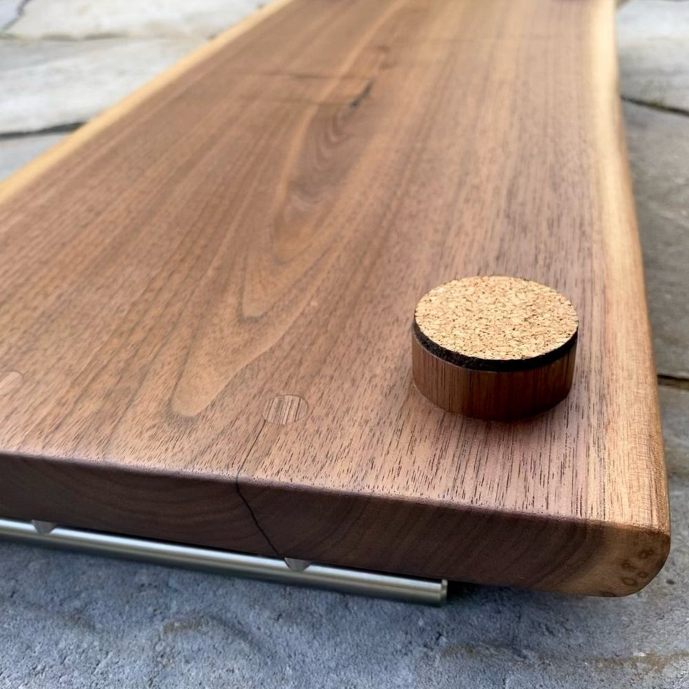 
                  
                    Walnut Live Edge Charcuterie Board - 24" with Handles & Feet - The Red Door Engraving Company Inc.
                  
                