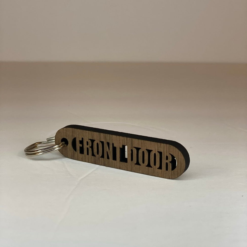 
                  
                    Walnut Wood Cut-Out Keychains Front Door - The Red Door Engraving Company Inc.
                  
                