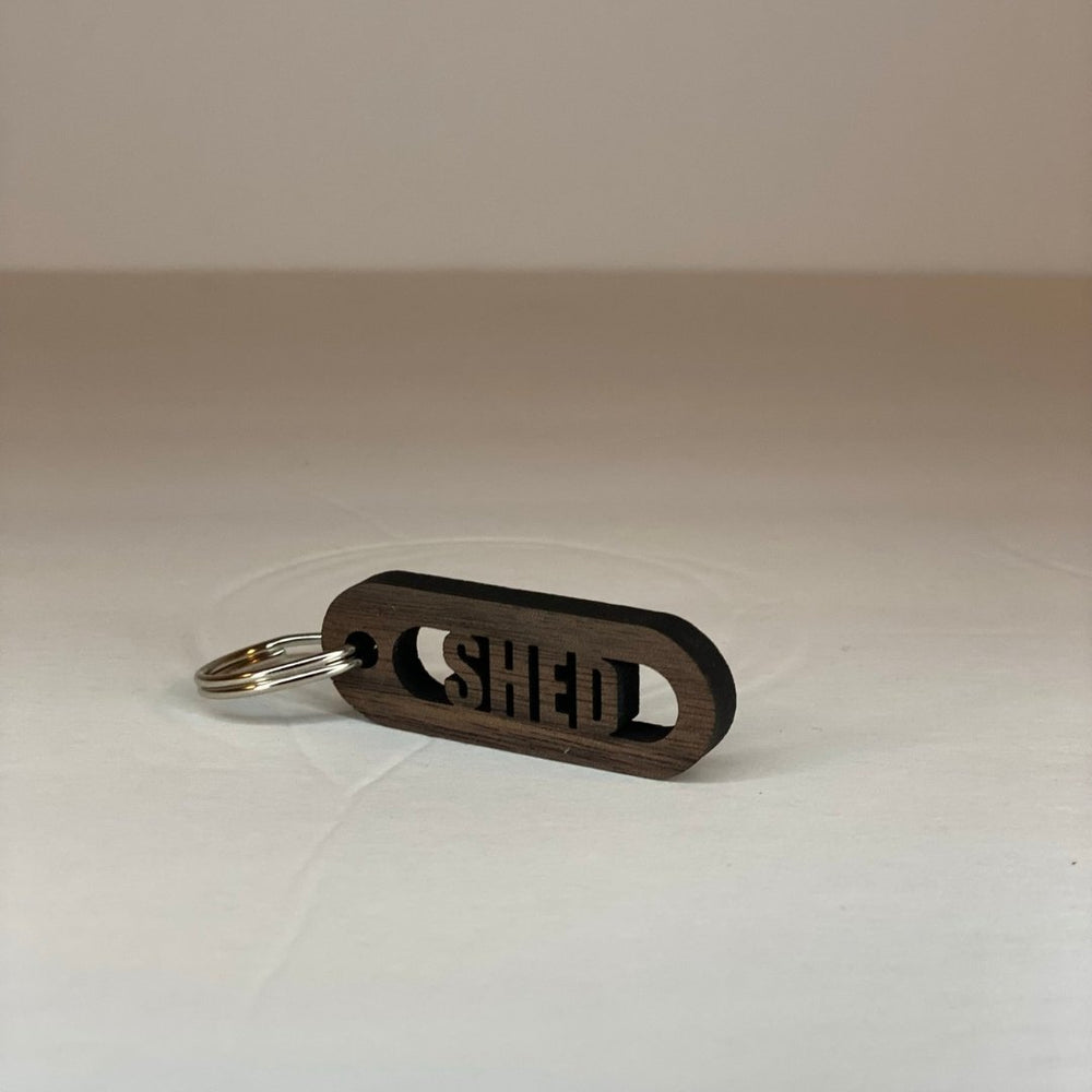 
                  
                    Walnut Wood Cut-Out Keychains Shed - The Red Door Engraving Company Inc.
                  
                